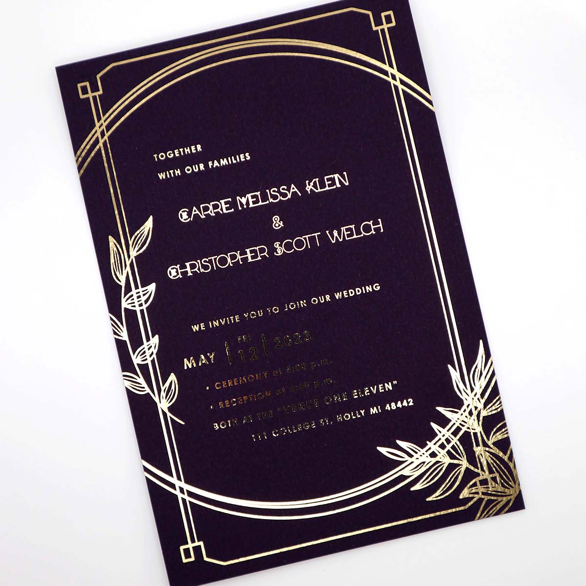 Elegant black wedding invitation featuring metallic gold foil with art deco-style borders on colorplan paper with a single sided design