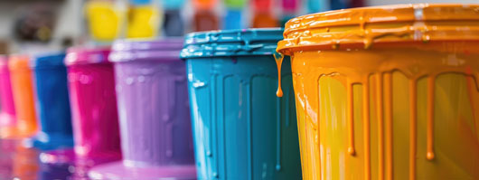 paint buckets filled with different colours