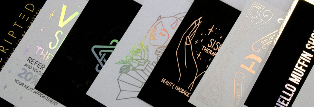 A lineup of black and white foil-printed cards we've printed for some of our customers, featuring gold, holographic and rose gold foil printing