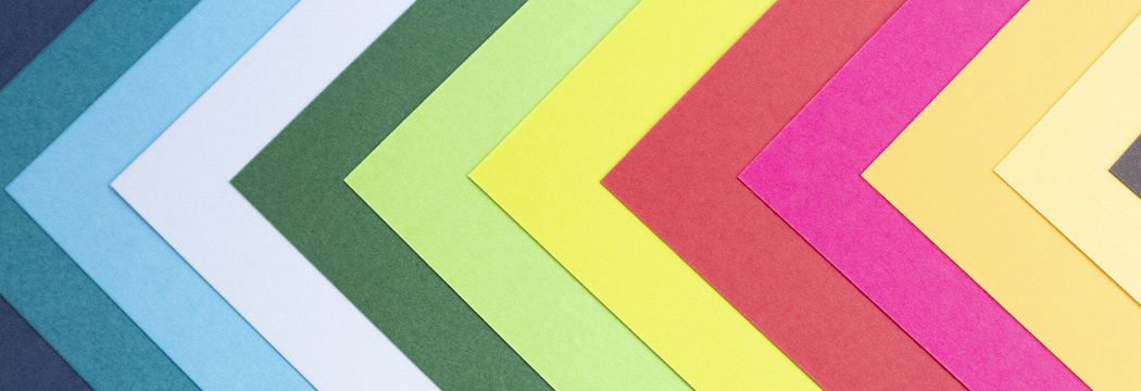 Our range of colored papers arranged at their corners in a sequence of chevrons