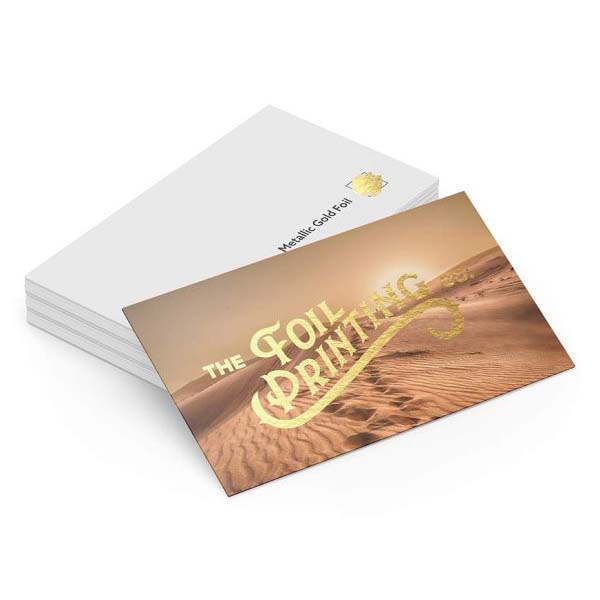 Desert print business card with a metallic gold brand logo overlaid